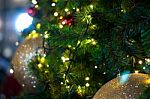 Close Up Big Yellow Glitter Ball Christmas On Tree With Wire White Light Background Stock Photo