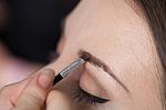 Close Up Of A Woman Putting On A Make Up Stock Photo