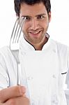 Close Up Of Chef Holding Fork Stock Photo