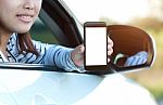 Close-up Phone In Woman Hand Showing Blank Screen Sitting In Car Stock Photo