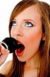 Close View Of Woman Singing Into Karaoke Stock Photo