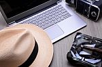 Closeup Of A Wooden Table With Laptop Stock Photo