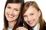 Closeup Of Mom And Daughter Flashing A Smile Stock Photo