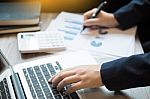 Closeup Of Young Business Man Working At Office With Laptop And Stock Photo