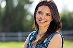 Closeup Portrait Of Cute Young Woman In The Park Stock Photo