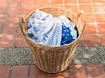 Clothes In A Laundry Wooden Basket Stock Photo