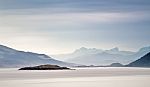 Coast Of  Norway Sea In Clouds Of Haze. Beacon On A Rock Stock Photo