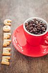 Coffee Alphabet Biscuit With Red Coffee Cup Stock Photo