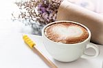 Coffee Cup With Notepad On Grey Background Stock Photo