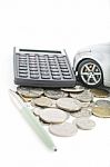 Coins, Calculator, Pen And Car Stock Photo