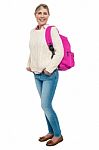 College Student In Winter Wear Posing With Pink Backpack Stock Photo