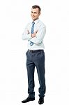 Confident Business Man With Arms Crossed Stock Photo