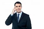 Confident Businessman Point Finger To Head Stock Photo