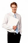 Confident Corporate Man Holding Laptop Stock Photo