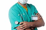 Confident Doctor Holding Stethoscope Stock Photo