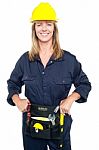 Confident Female Worker In Yellow Helmet Stock Photo