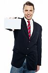 Confident Sales Representative Presenting Blank Placard Stock Photo