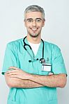 Confident Smiling Young Doctor Posing Stock Photo