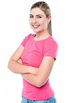 Confident Young Girl Posing, Arms Crossed Stock Photo