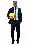 Construction Engineer Holding Hard Hat Stock Photo