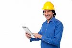 Construction Worker Operating Tablet Pc Stock Photo