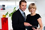 Corporate Couple Reviewing Weekly Schedule Stock Photo