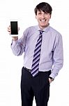 Corporate Executive Displaying Stylish Cellphone Stock Photo