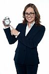 Corporate Executive Pointing Towards The Clock Stock Photo