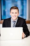 Corporate Guy Browsing In His Laptop Stock Photo