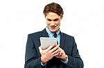 Corporate Guy Browsing On His Tablet Pc Stock Photo