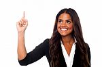 Corporate Lady Pointing Upwards Stock Photo