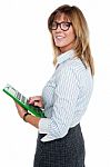 Corporate Lady Using Big Green Calculator Stock Photo