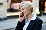 Corporate Lady Using Her Phone Stock Photo