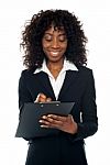 Corporate Lady Writing On Clipboard Stock Photo