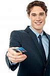 Corporate Man Offering You Credit Card Stock Photo