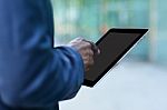 Corporate Man Working With A Digital Tablet Stock Photo