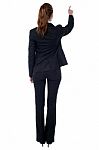 Corporate Woman Pointing At Something Stock Photo