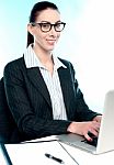 Corporate Woman Typing On Laptop Stock Photo