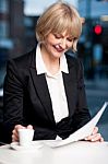 Corporate Women In Cafe With Reports Stock Photo