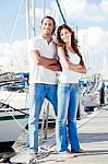 Couple Crossing Arm At Harbor  Stock Photo