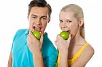 Couple Eating Green Apple Stock Photo