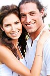 Couple Embracing And Smiling Stock Photo