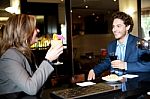 Couple Enjoying Cocktail At The Bar Stock Photo