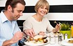 Couple Enjoying Delicious Breakfast Stock Photo