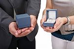 Couple Hands Holding Boxes With Rings. Valentines Day And Engage Stock Photo