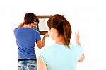 Couple Hanging A Mirror Stock Photo