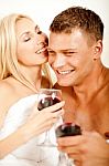 Couple In Bedroom With Wine Stock Photo