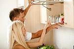 Couple In Kitchen Stock Photo