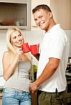 Couple In Kitchen With Coffee Stock Photo