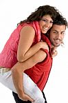 Couple Riding Piggy Back Stock Photo